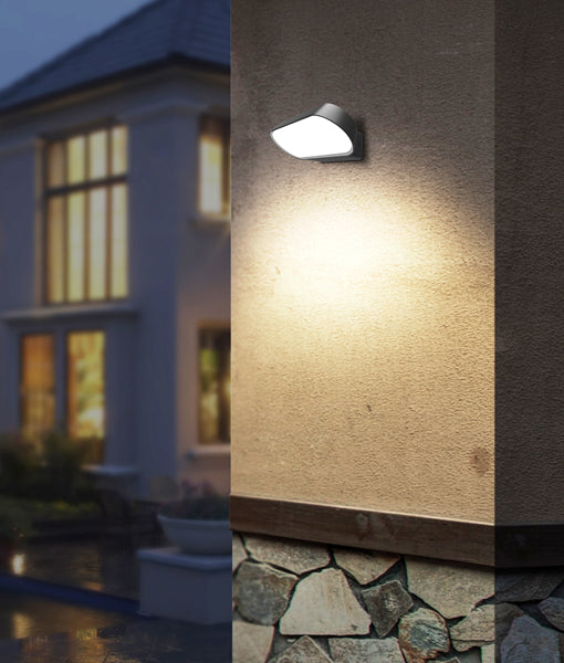 CLA Glans exterior wall light illuminating the entrance of a home