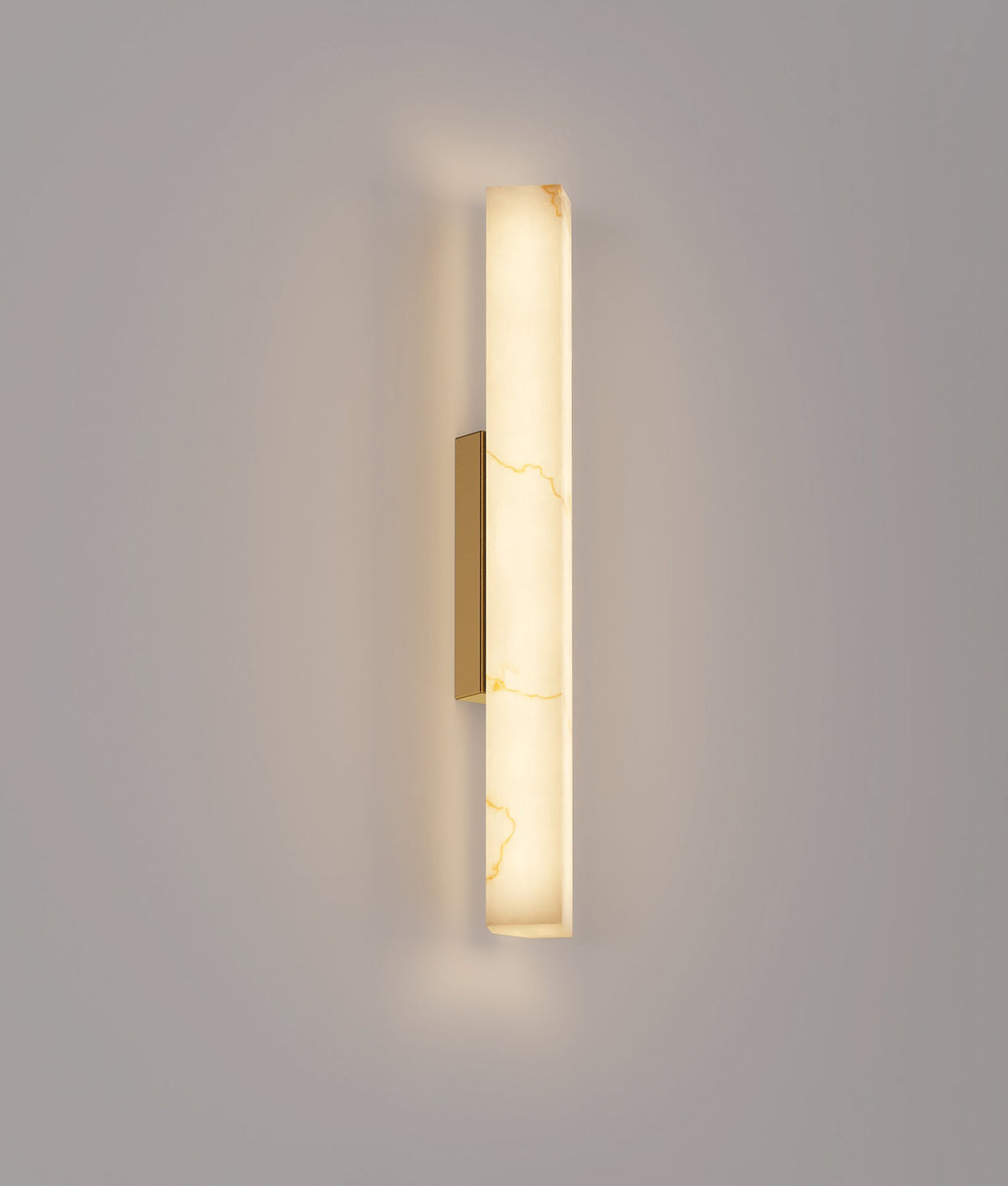 CLA FLECHA2M medium angled faux marble wall light – illuminated view