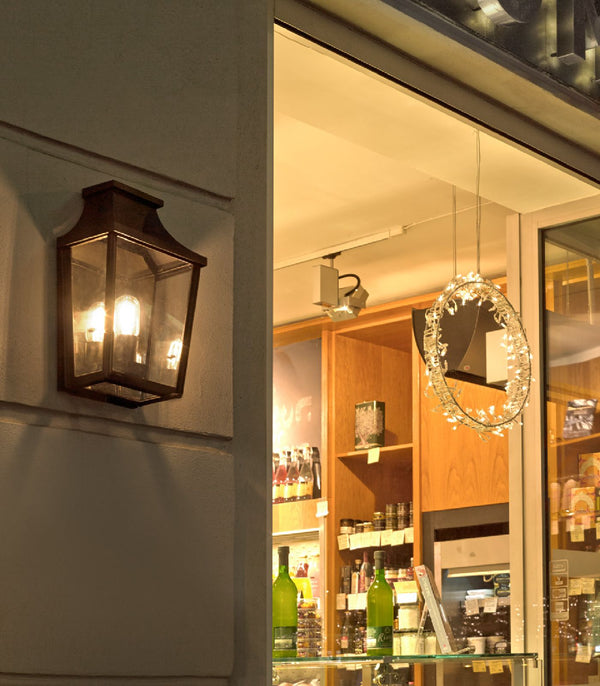 Norlys London lantern wall light installed beside a warmly lit doorway